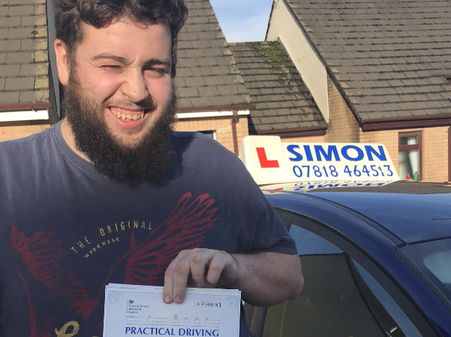 Young man passed driving test.